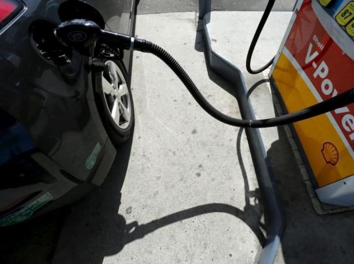 A car is filled with gasoline at a gas station pump in Carlsbad